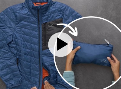 A blue stowaway jacket shown in two different ways: laid out flat and stowed away in it's own pouch.