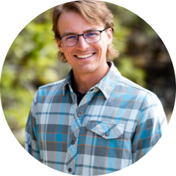 Tucker V in a plaid shirt