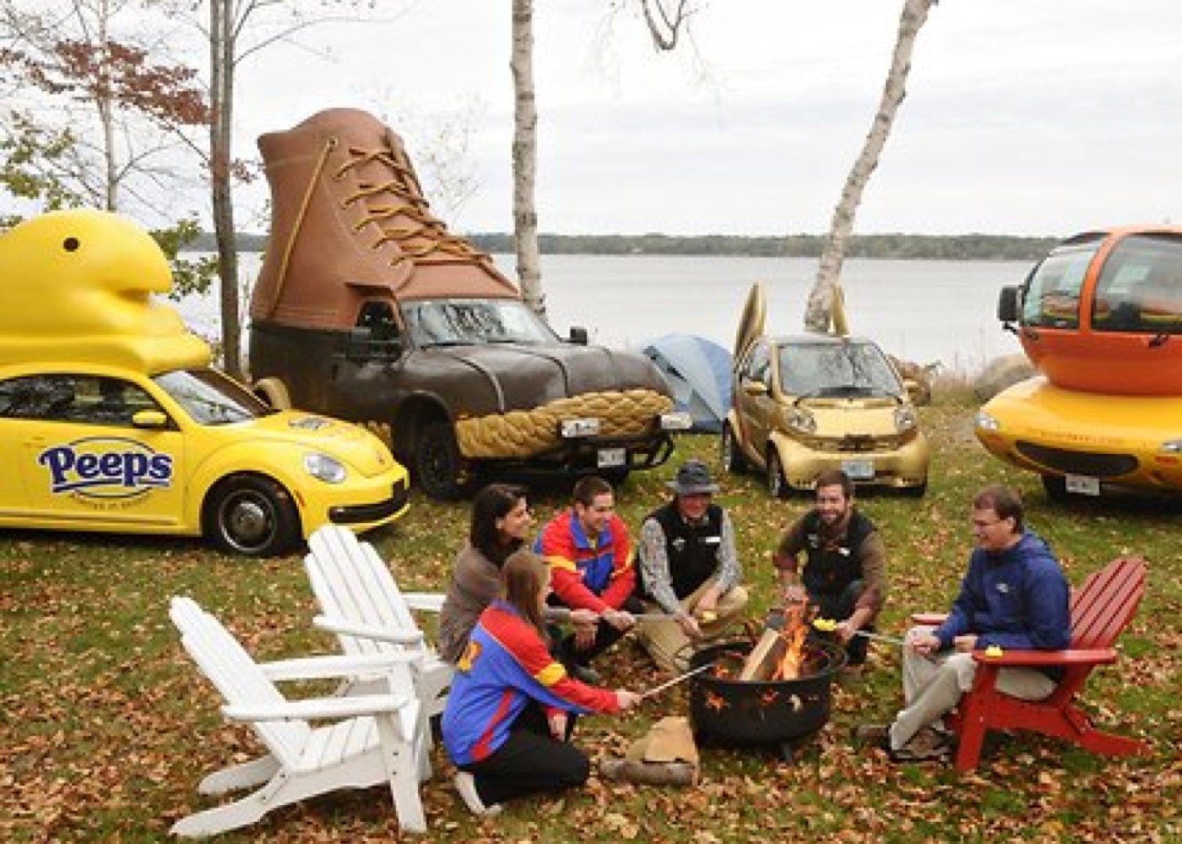 Bootmobile parked in front of campfire with other vehicles celebrating Art Car Campout in Freeport.