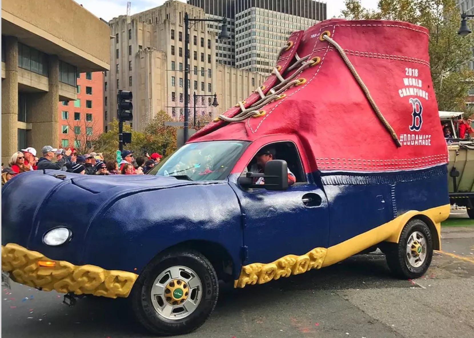 A giant red and blue L L Bean Boot with "2018 World Champions" and the Boston Red Sox logo on it.
