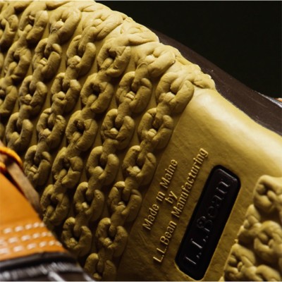 Close-up of the sole of an L.L. Bean boot showing the tread pattern and text Made in Maine by L.L. Bean Manufacturing.