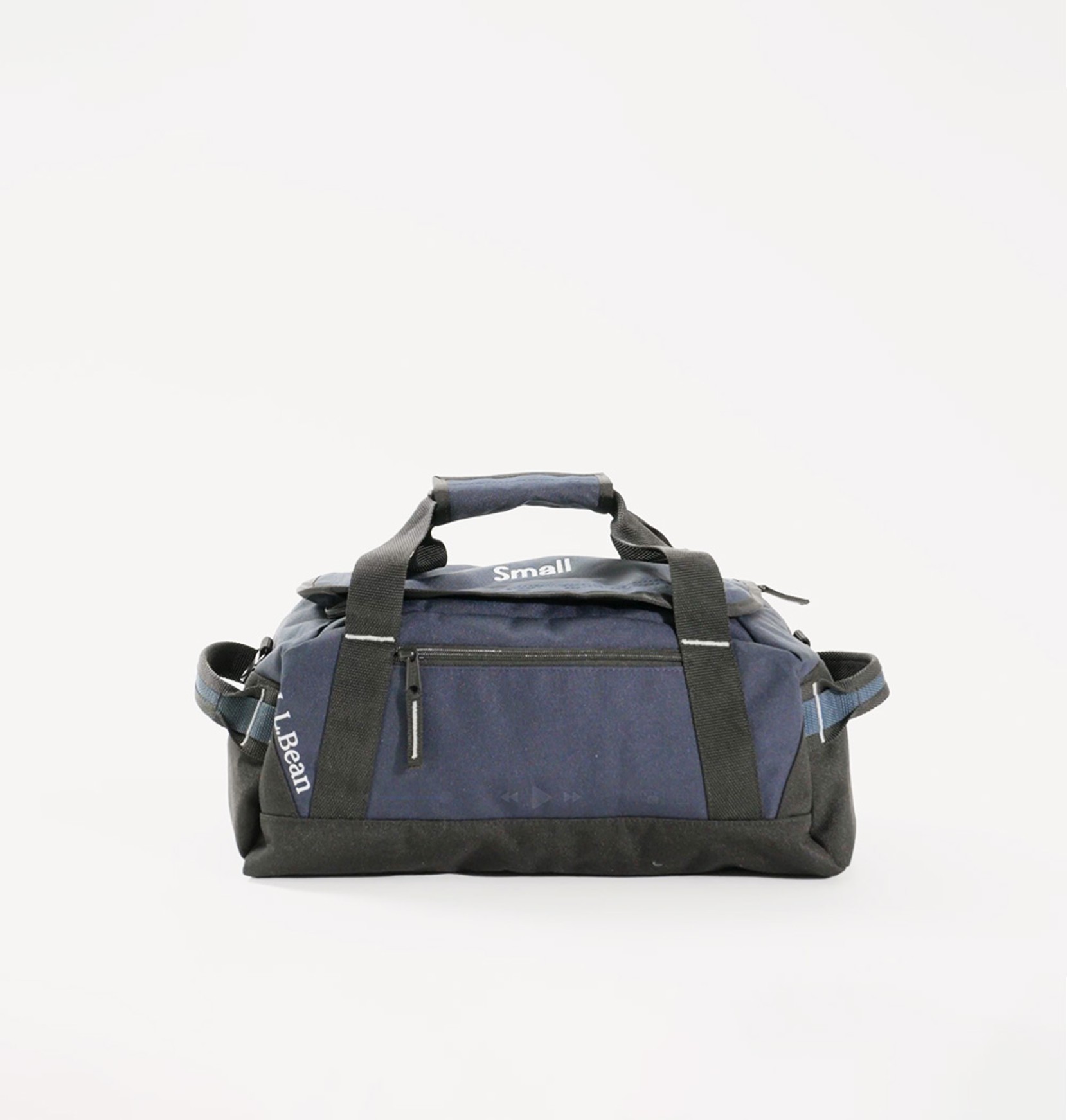 Side view of a small, navy Adventure Duffle on an eggshell white background.