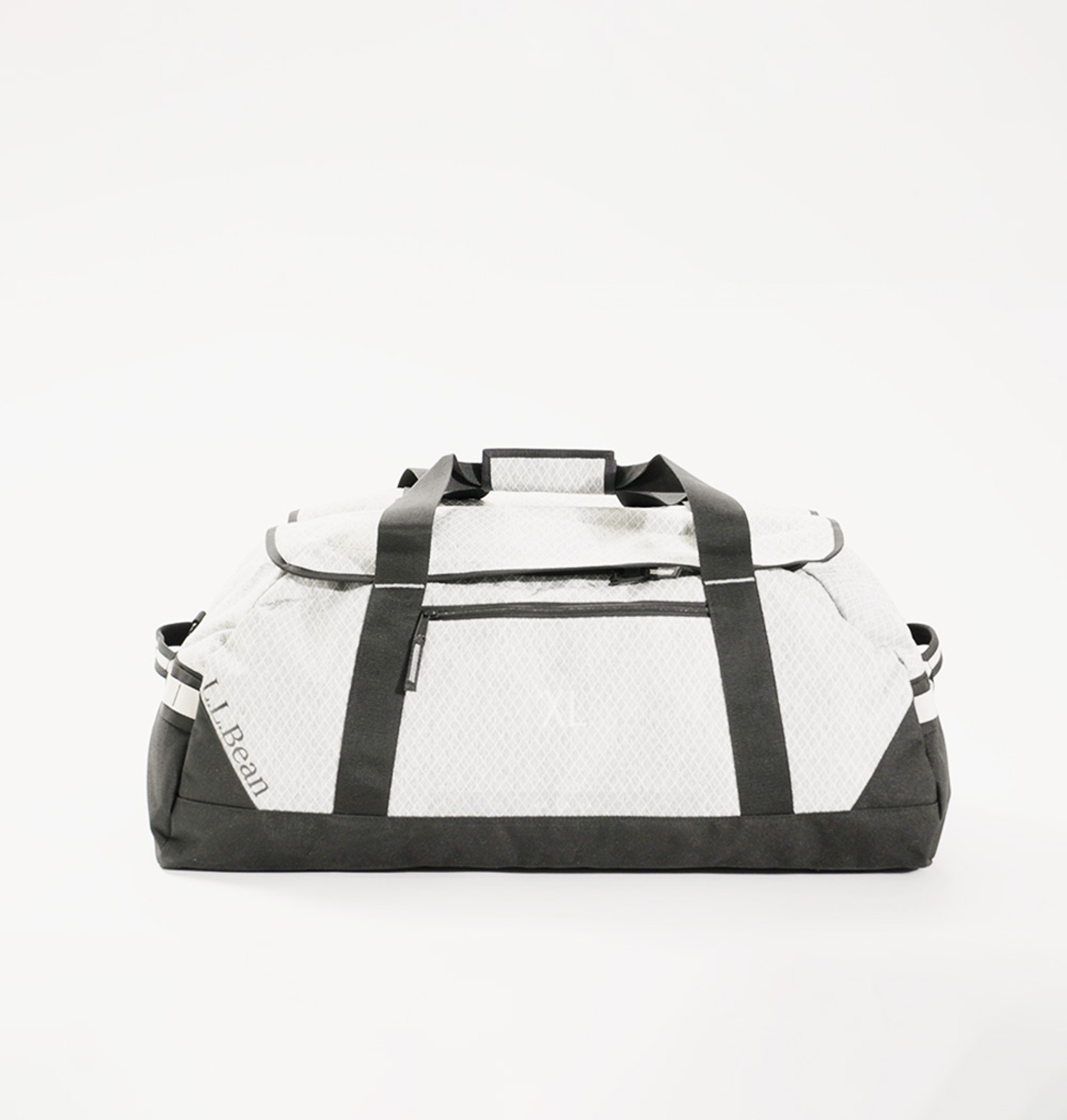 Side view of an extra large, white Adventure Duffle on an eggshell white background.