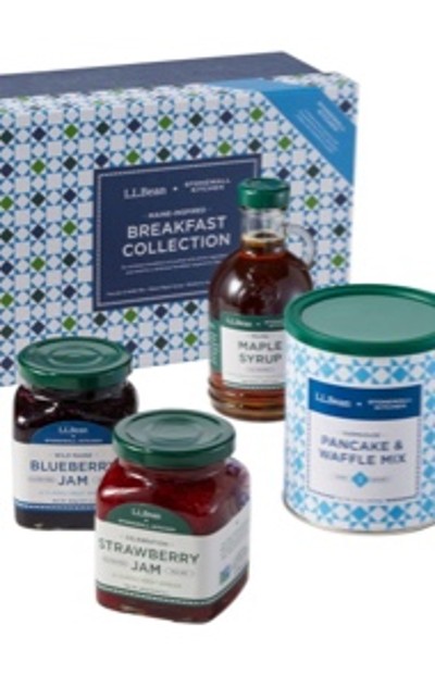 L L Bean breakfast collection with blueberry jam, strawberry jam, maple syrup, and pancake & waffle mix in front of a patterned box.