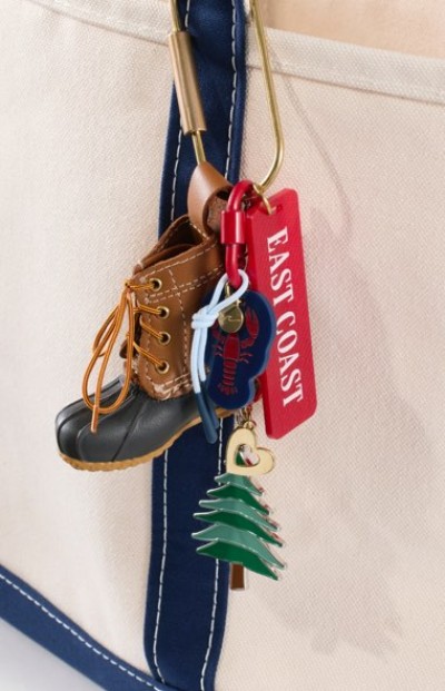 Canvas bag with a keychain showing a boot, lobster, tree, and an “EAST COAST” tag, highlighting regional charm.