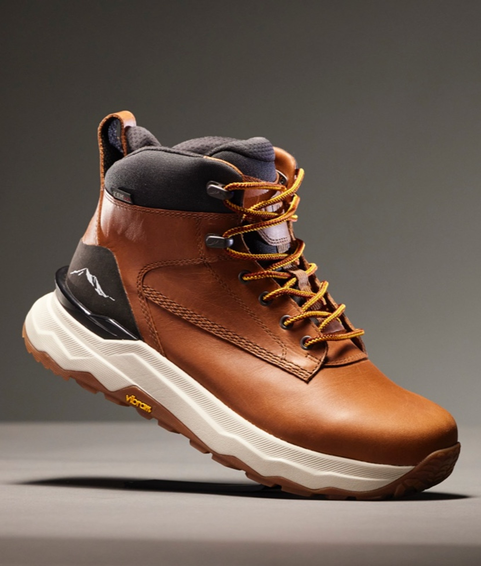 One men's hiking boot slightly tilted up on its toe.
