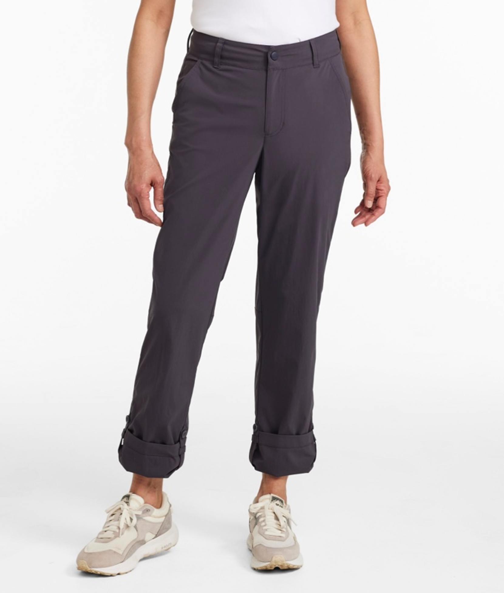 A waist down shot of a woman wearing hiking pants.