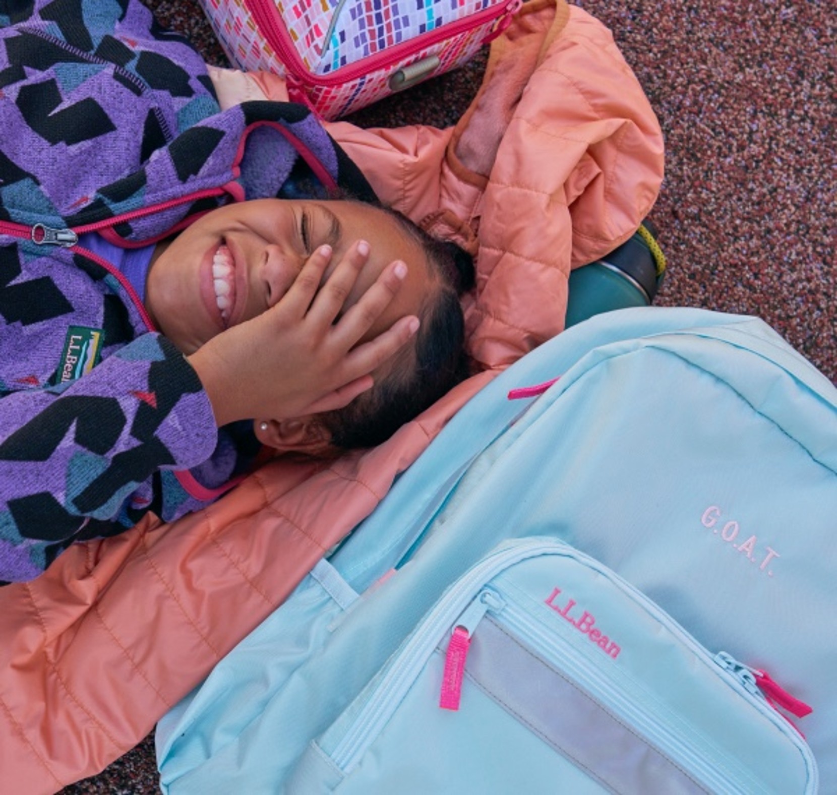 Child standing with an L.L.Bean Backpack