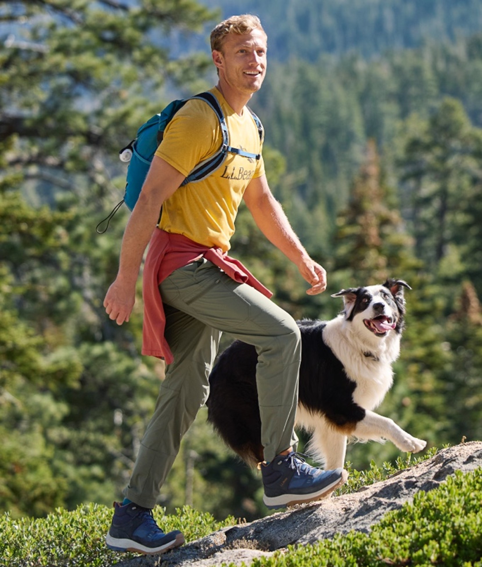 A man hiking a dog.