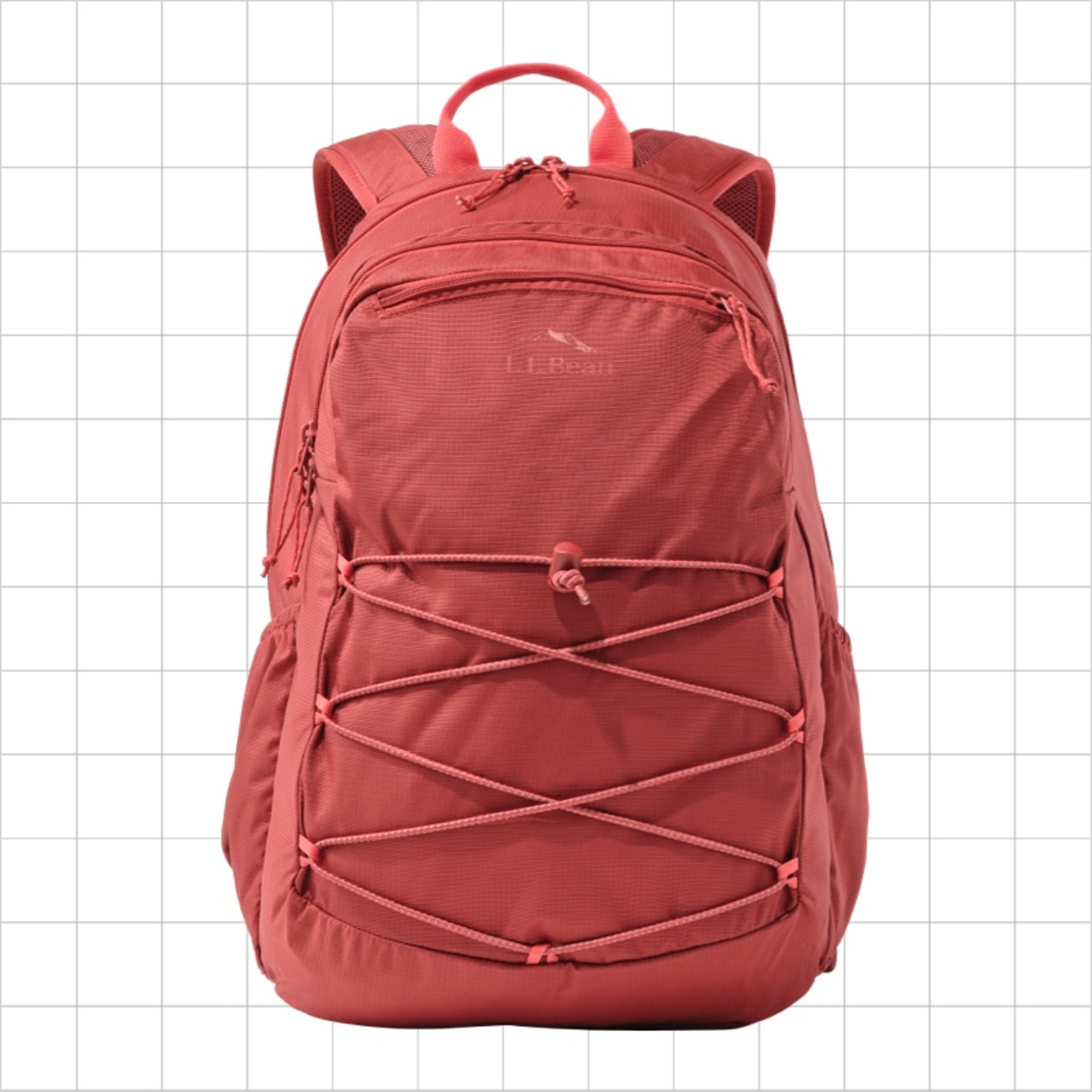 A salmon school backpack with a criss-cross cord strap on the front.