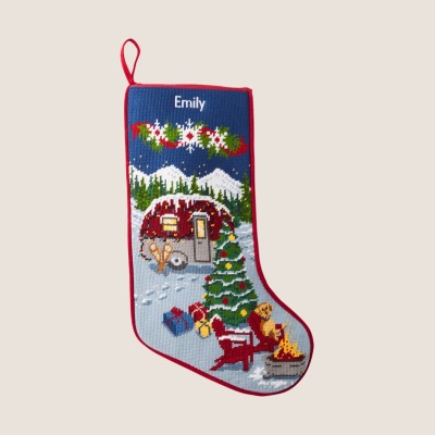 Personalized holiday stocking with festive house and tree design monogrammed with the name Emily.
