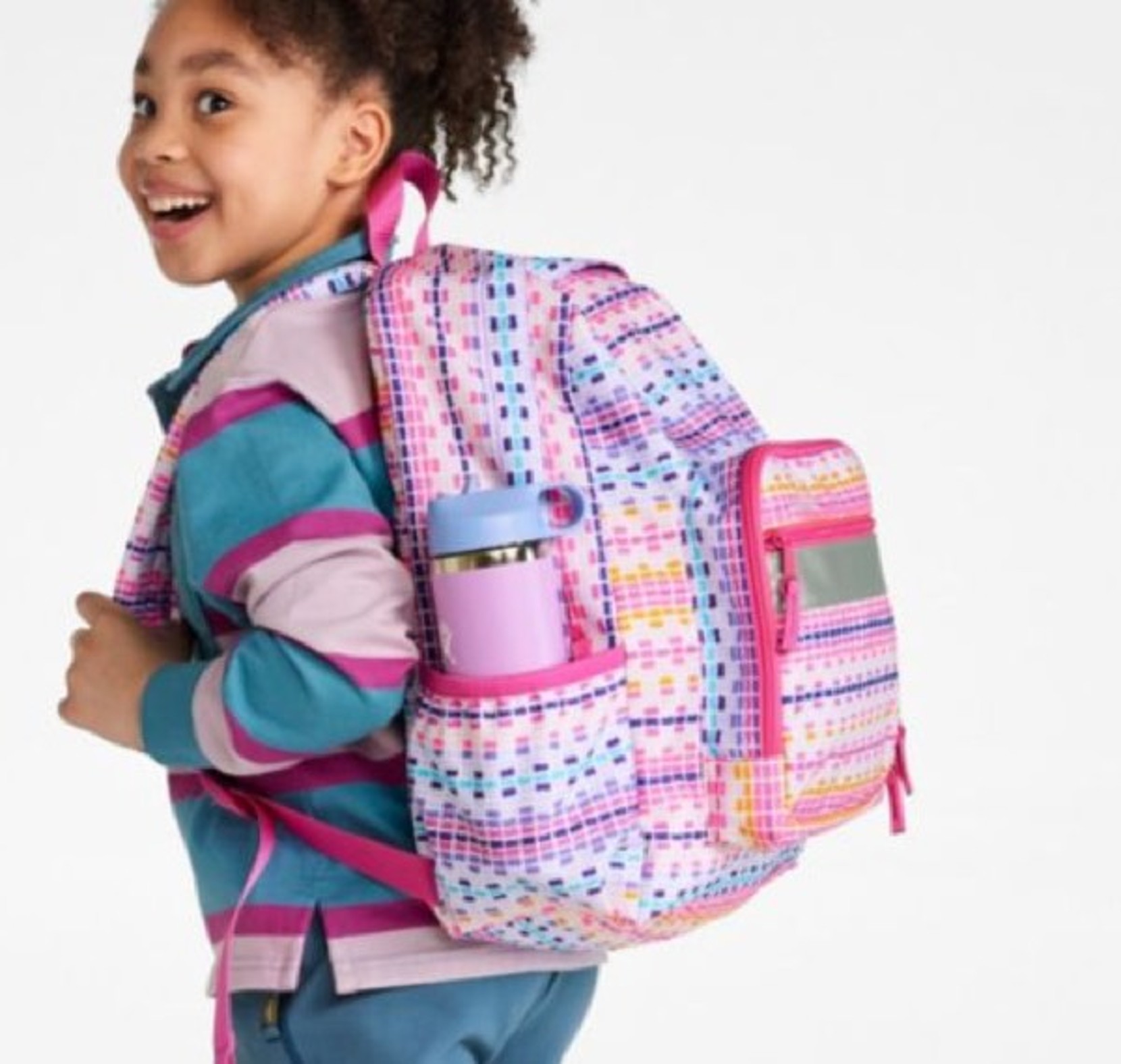 Child standing with an L.L.Bean Backpack