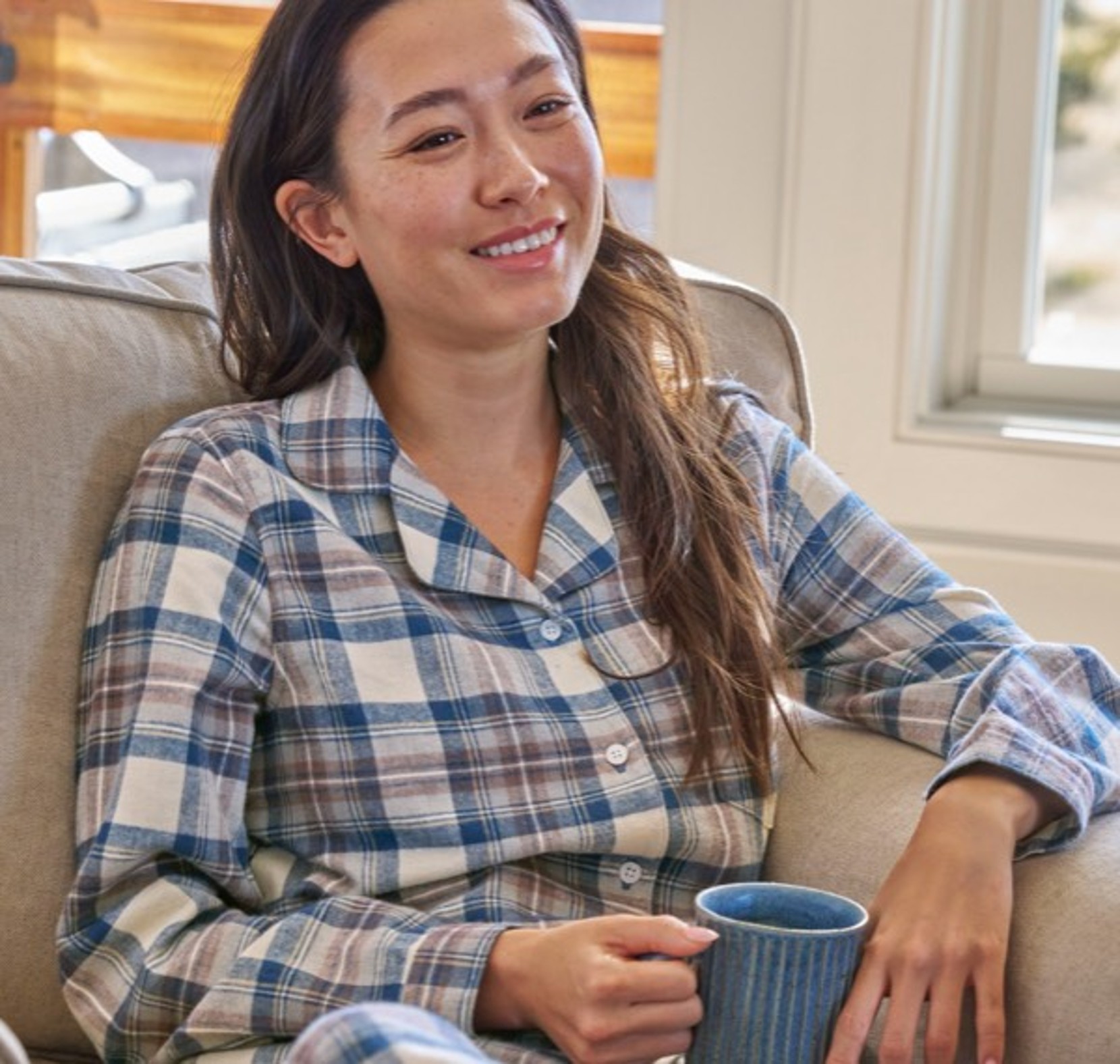 A women sitting in L.L.Bean Flannel PJs