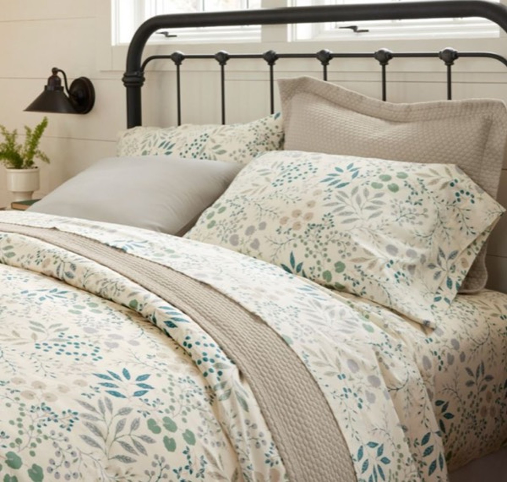 Bed made with floral Percale Sheet.