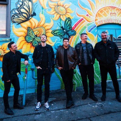 The band Toby McAllister & The Sierra Sounds pose for the camera.