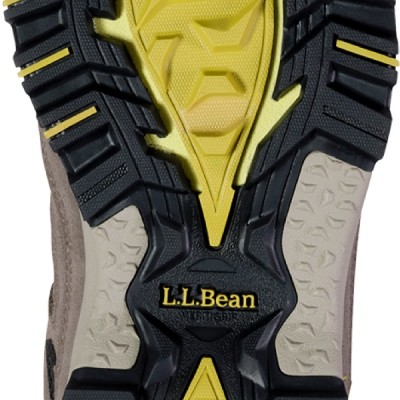 The underside of a hiker boot shows deep lugs indicating it's rugged traction abilities.