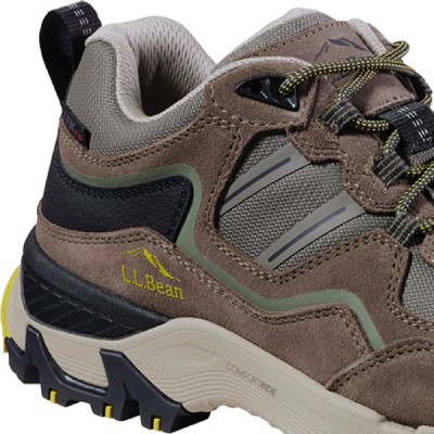 A three quarter view close up of a hiker boot with an emphasis on the E V A midsole's cushion.