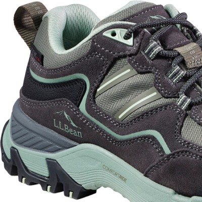 A three quarter view close up of a hiker boot with an emphasis on the E V A midsole's cushion.