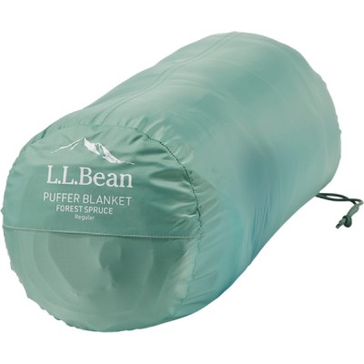 An green cylindrical bag with the text L L Bean PUFFER BLANKET printed on it. 