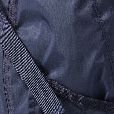 A close-up of a dark blue fabric with a textured strap running diagonally across it.