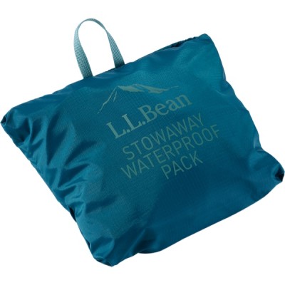 A blue, folded Pack with a handle on top and text that reads L L Bean STOWAWAY WATERPROOF PACK.