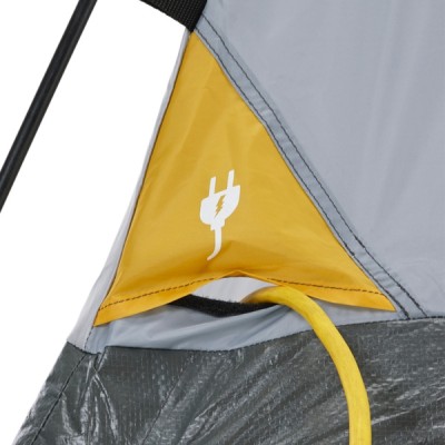 A tent corner with yellow and gray fabric, featuring a white electrical plug symbol and a yellow cord extending from it.