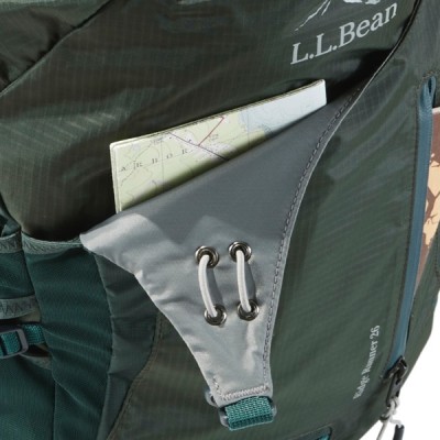 A green L L Bean backpack with a map partially visible in the side pocket. 