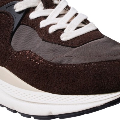 Three quarter close up view of the front of a sneaker.