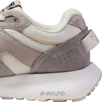 Interior side view of the back half of a gray and white sneaker.