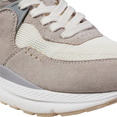 Three quarter close up view of the front of a sneaker.