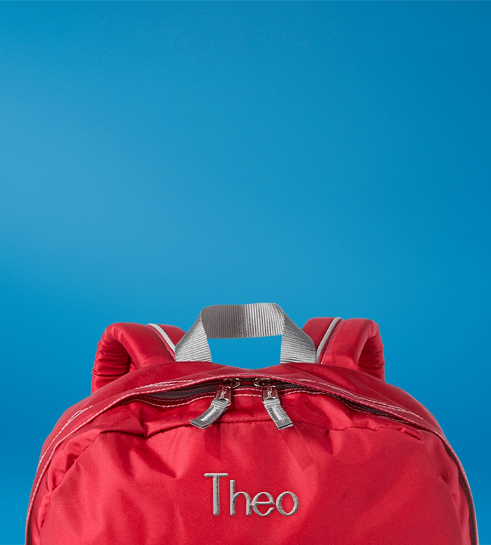 Red L. L. Bean backpack against a blue gradient background, with front zipper pocket and top handle visible.