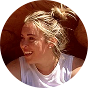 Portrait of Lindsey B. smiling in the sunshine