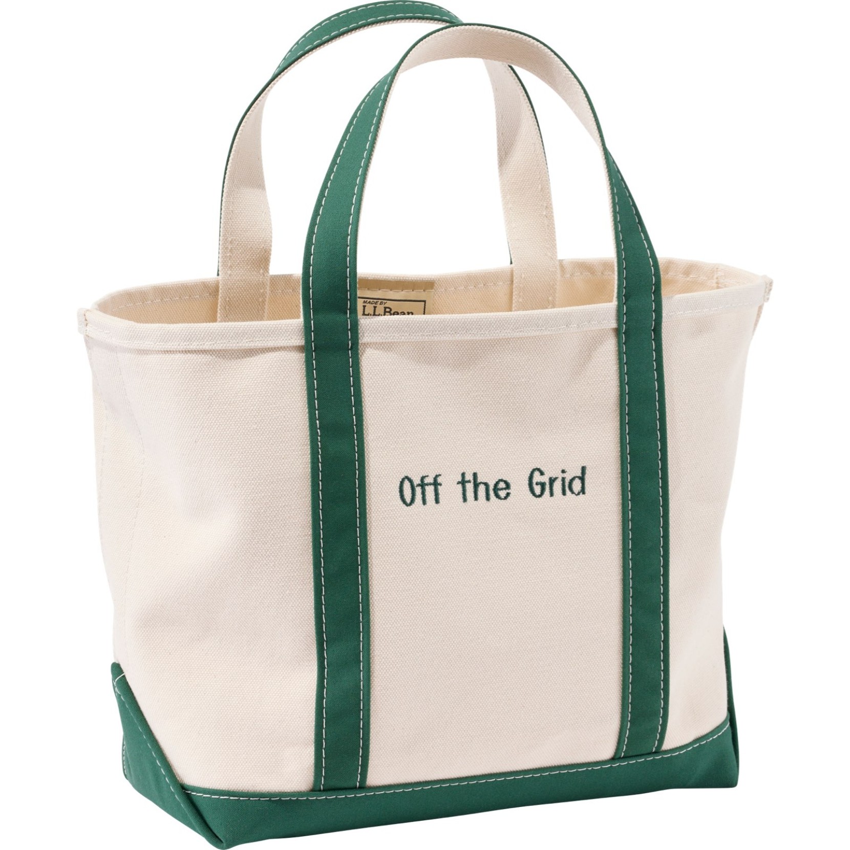 Canvas Boat and Tote bag with green handles and a green monogram that reads "Off the Grid".