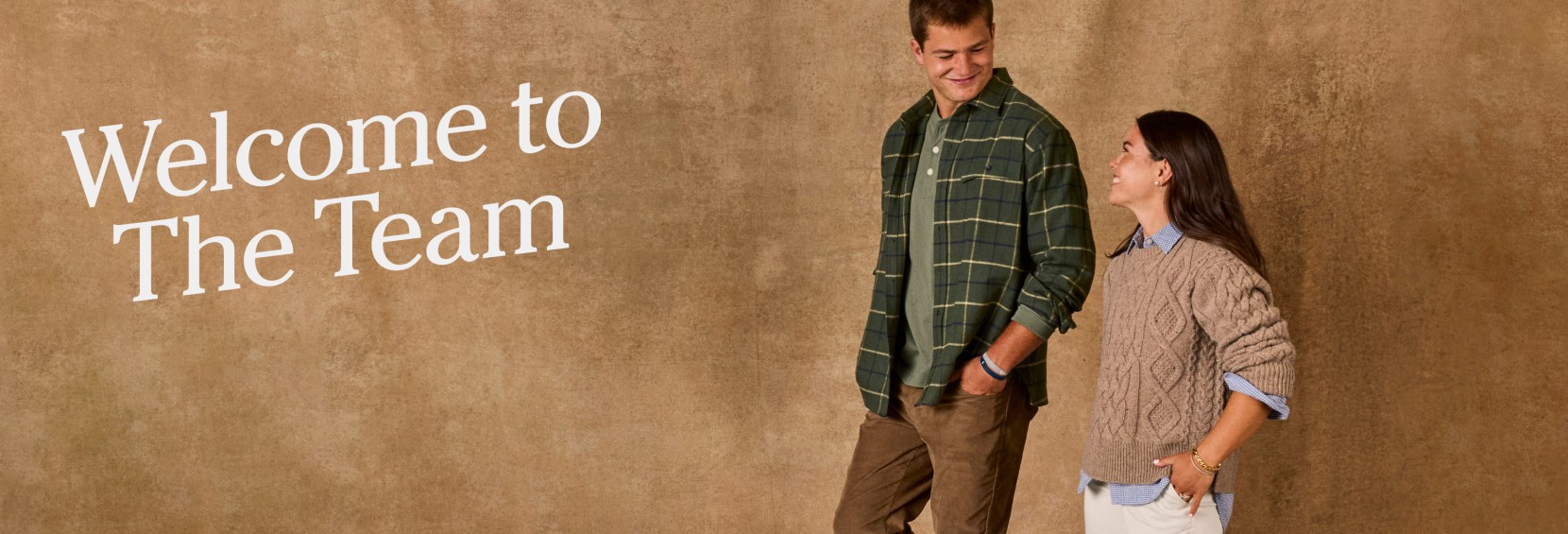 Drake and Ann Michael Maye looking at each other and smiling, wearing L.L.Bean apparel with text "Welcome to The Team".