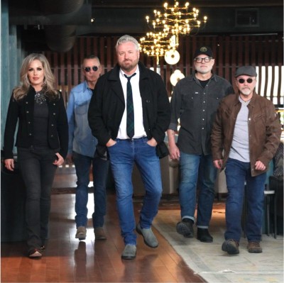 Don Campbell Band, 5 people, walking toward the camera.