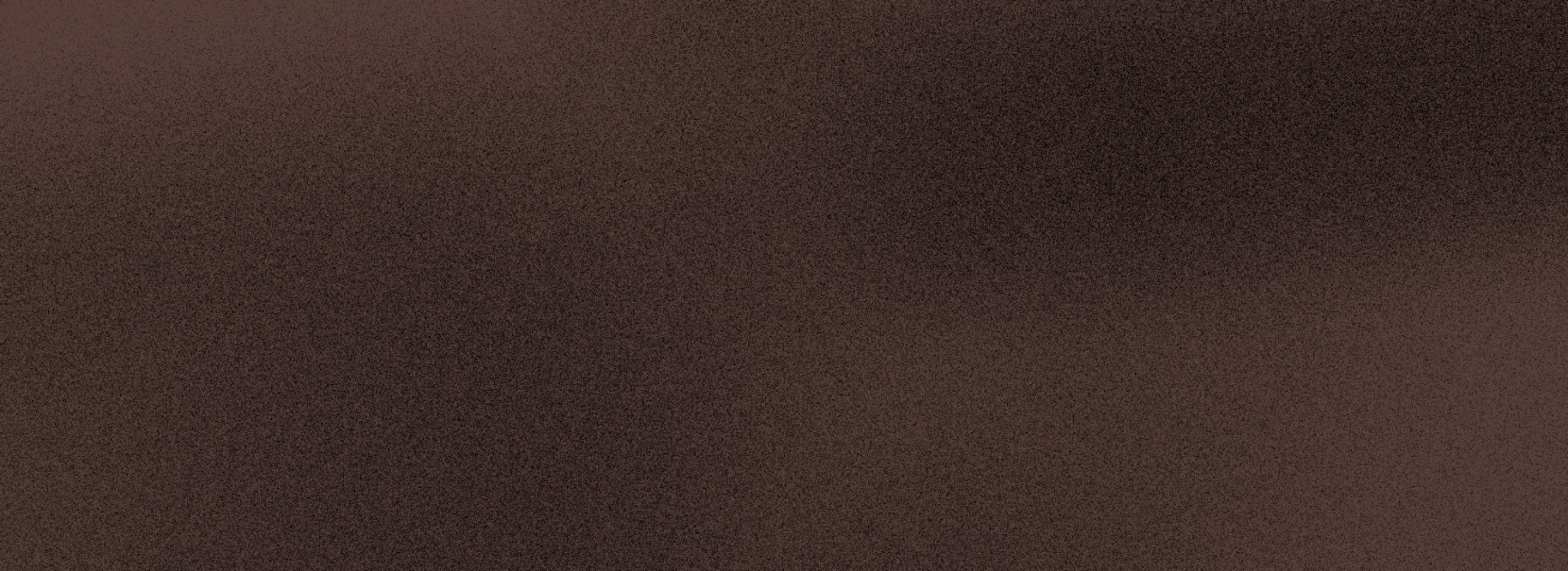 Dark brown textured surface with a subtle mottled pattern and soft tonal variations.