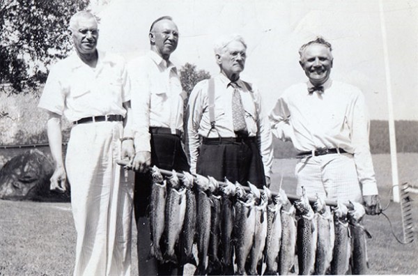 L.L. and his favorite fishing buddies holding their catches.