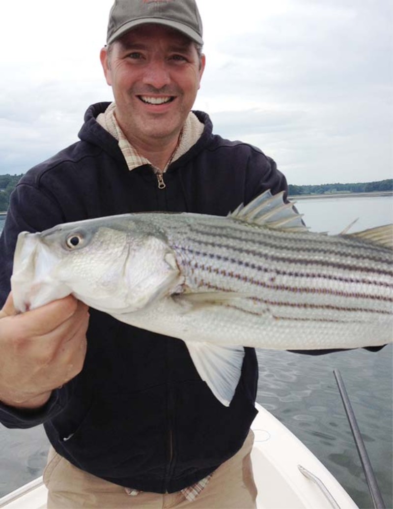 Shawn Gorman, the L.L.Bean chairman of the board, holding a fish.