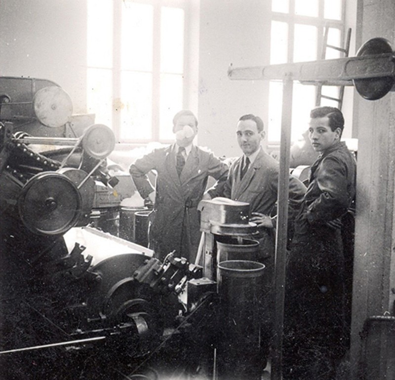 First-generation family members of Norlender Knitwear with the company’s original knitting machine