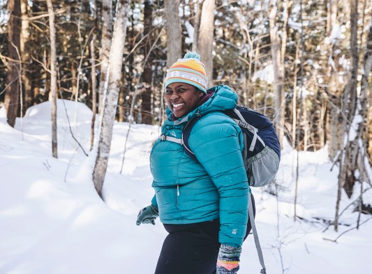 Mirna Valerio enjoying a snowy hike on her Vermont property