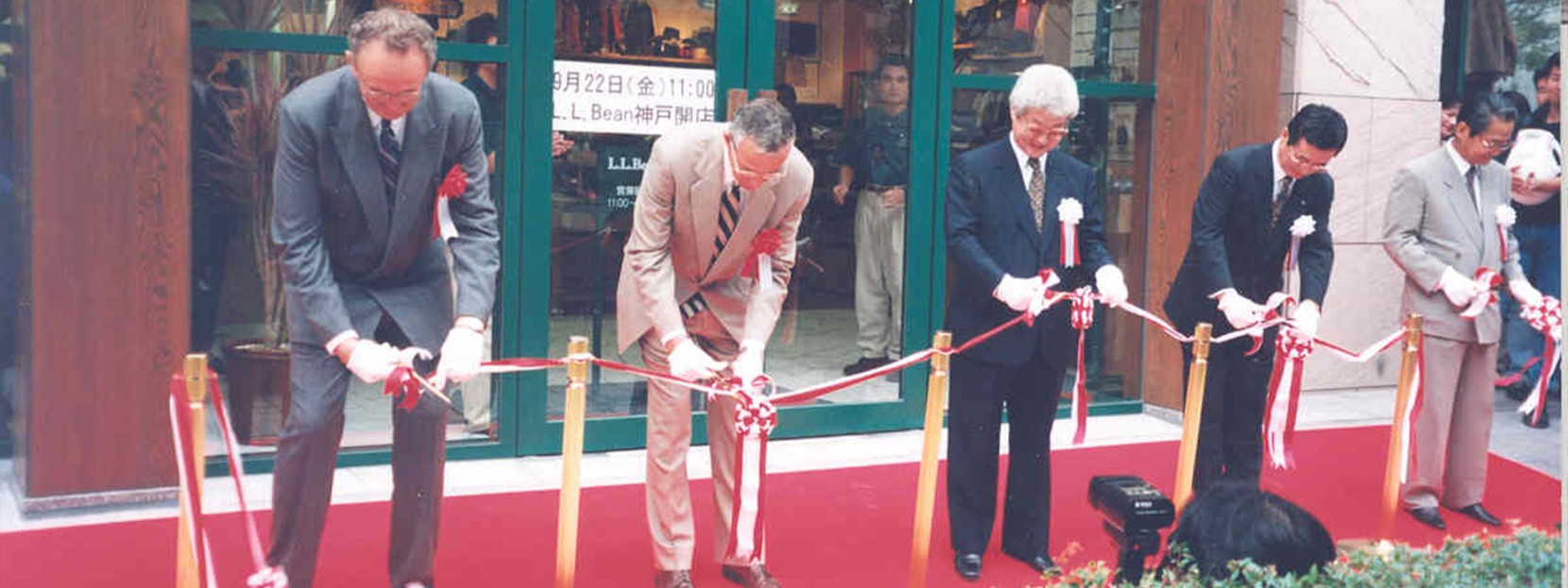 Jim Gorman, Sr., Leon Gorman and LLBJ representatives cutting the ribbon for the Kobe, Japan LLB store opening. September 22, 1995.
