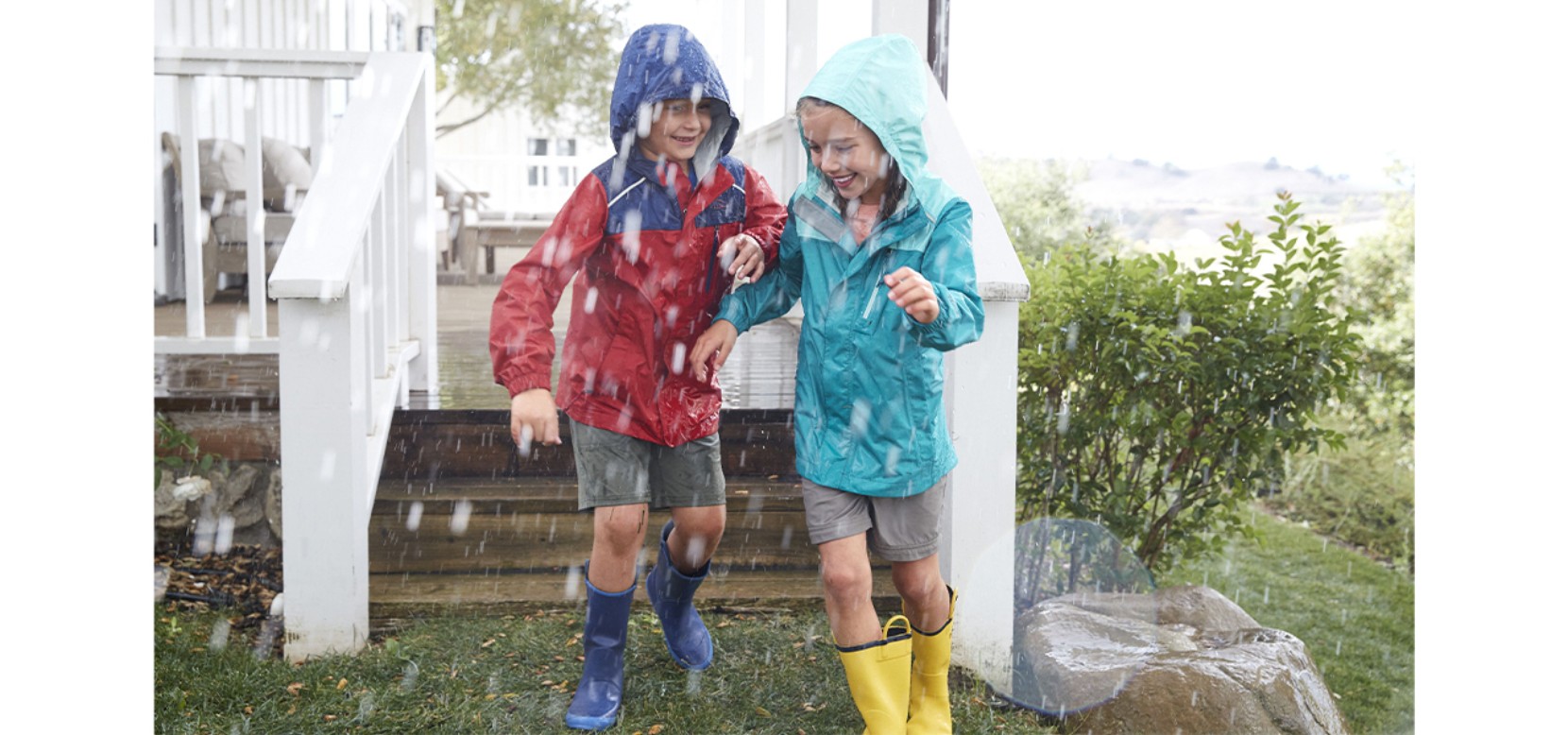 Kid splashing in L.L.Bean puddle stompers