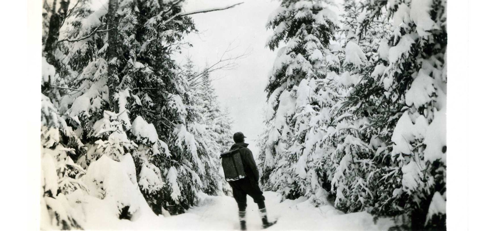 Man Snowshoeing with Pack Basket, Date Unknown