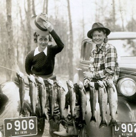 Two women, posing with their recent fishing catch