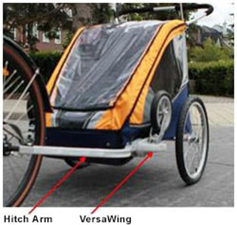 Chariot Cougar I with red arrows pointing to the hitch arm and the VersaWing.